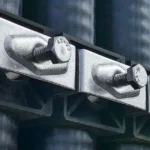Stainless steel hex bolts securing heavy duty cable clamps in electrical installation