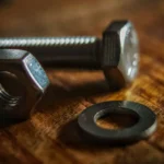 Stainless steel hex bolt nut and washer set on wooden background for mechanical assembly
