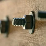 hex bolt installed with flat washer and hex nut on wooden structure